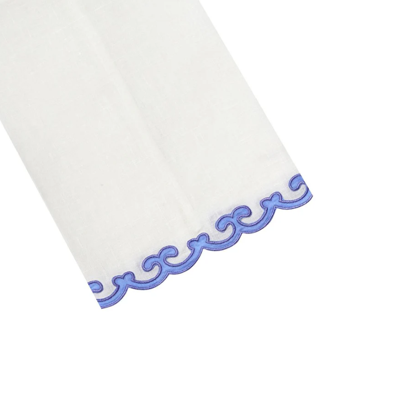 White fabric tip towel with blue decorative border on a white background