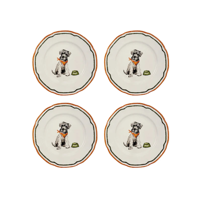 Four ceramic plates with illustrations of dogs and bones on a white background