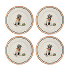 Four ceramic plates with dog illustrations on a white background