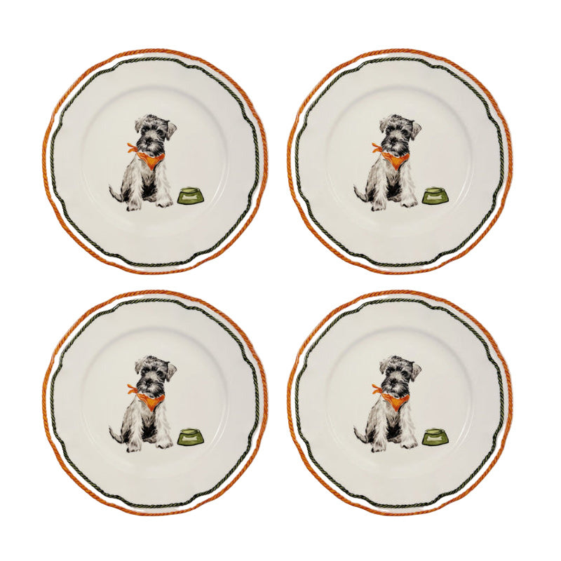 Four ceramic plates with dog illustrations on a white background