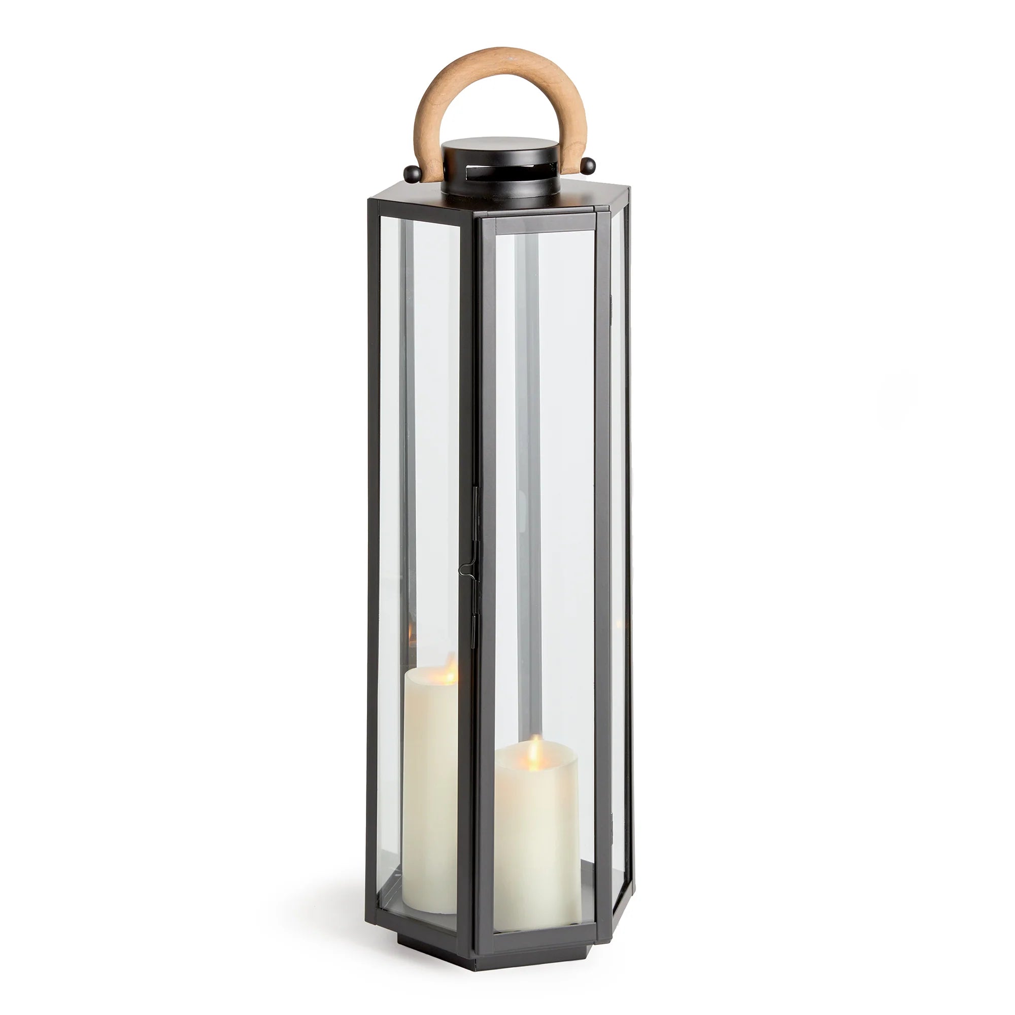 Tall black lantern with a wooden handle and two white candles inside on a white background