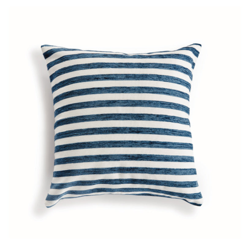 Blue and white striped square pillow on white background
