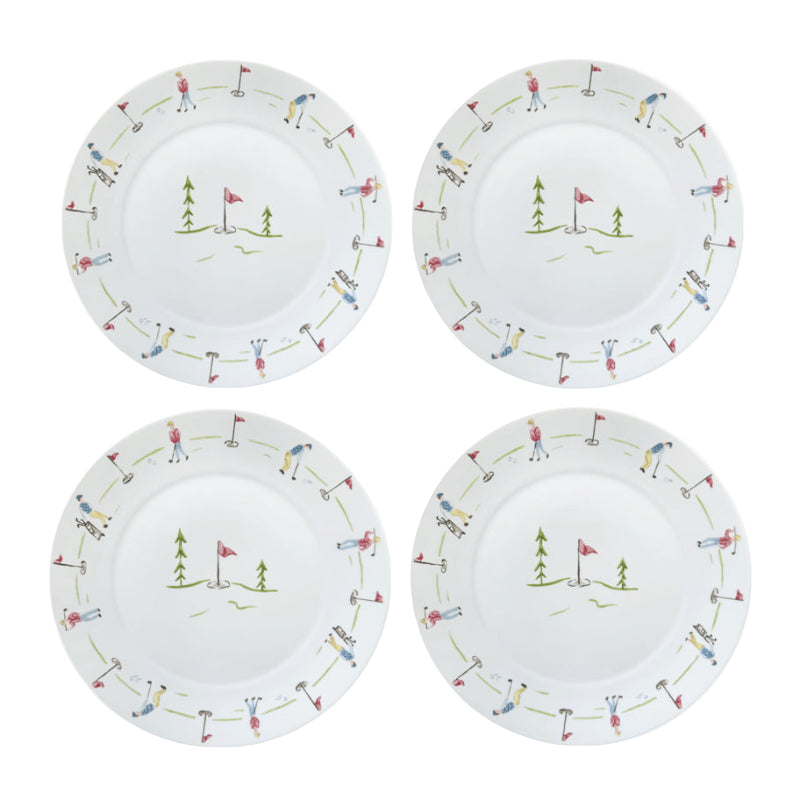 Four white plates with golf-themed decorative rims on a white background