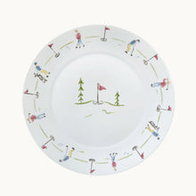 Golf-themed plate with illustrations of golfers and flags on a white background