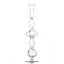 Clear glass hourglass on a white background