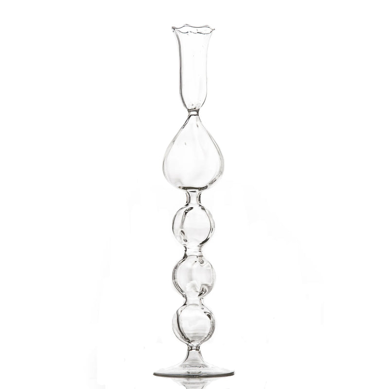 Clear glass hourglass on a white background