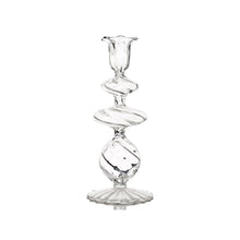 Clear glass candle holder on a white background