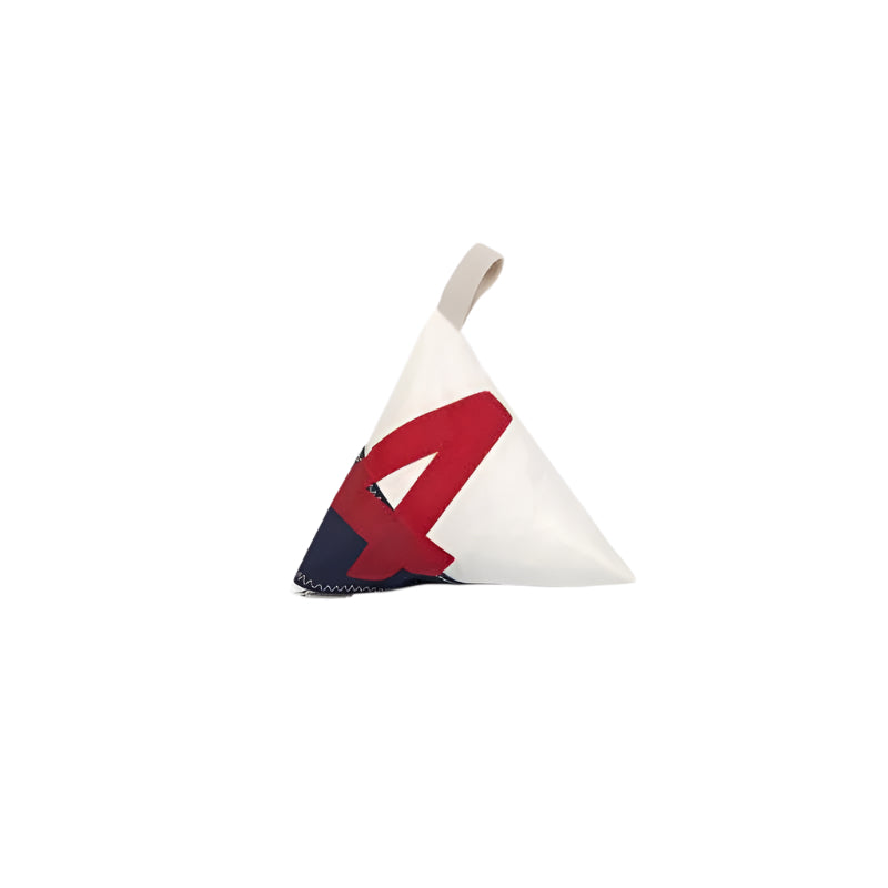 Triangular fabric weight with red and blue design on a white background