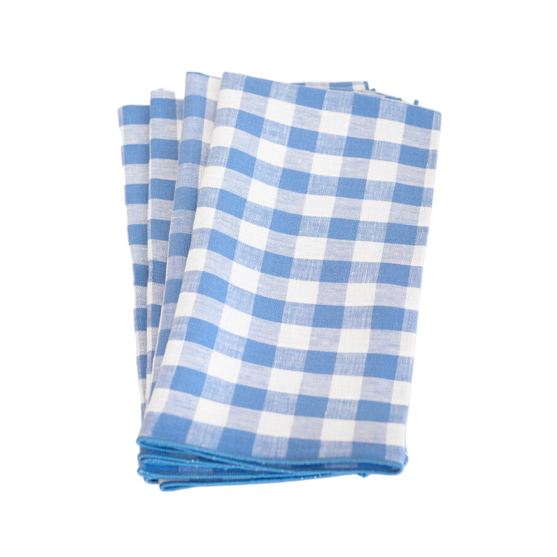 Set of blue and white checkered napkins on a white background