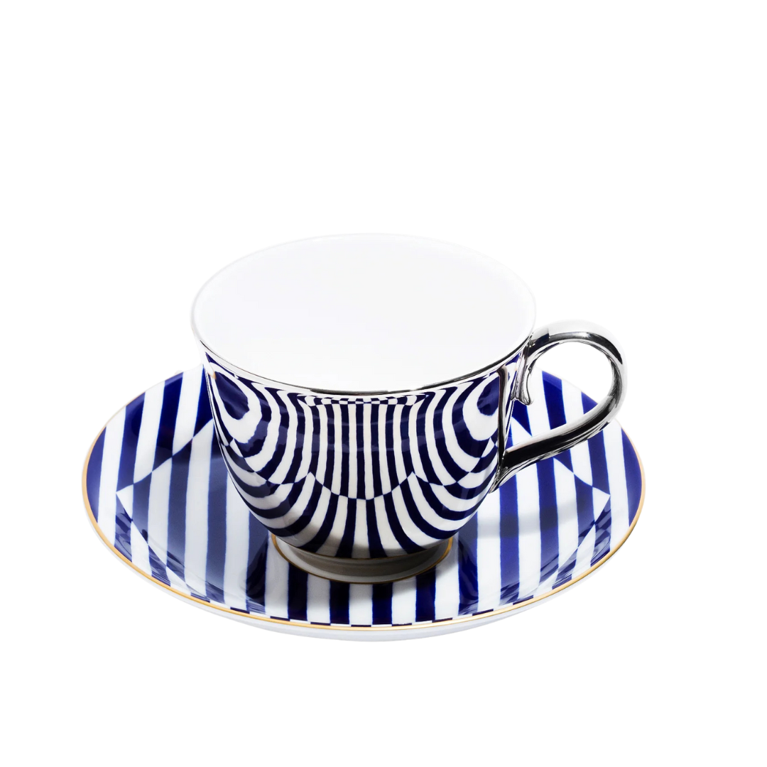 Teacup and saucer with blue and white striped design on a white background