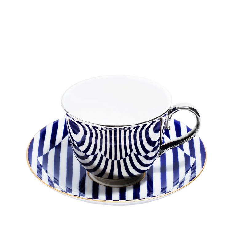 Teacup and saucer with blue and white striped design on a white background