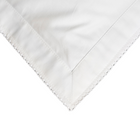 White fabric with white embroidery on a white background