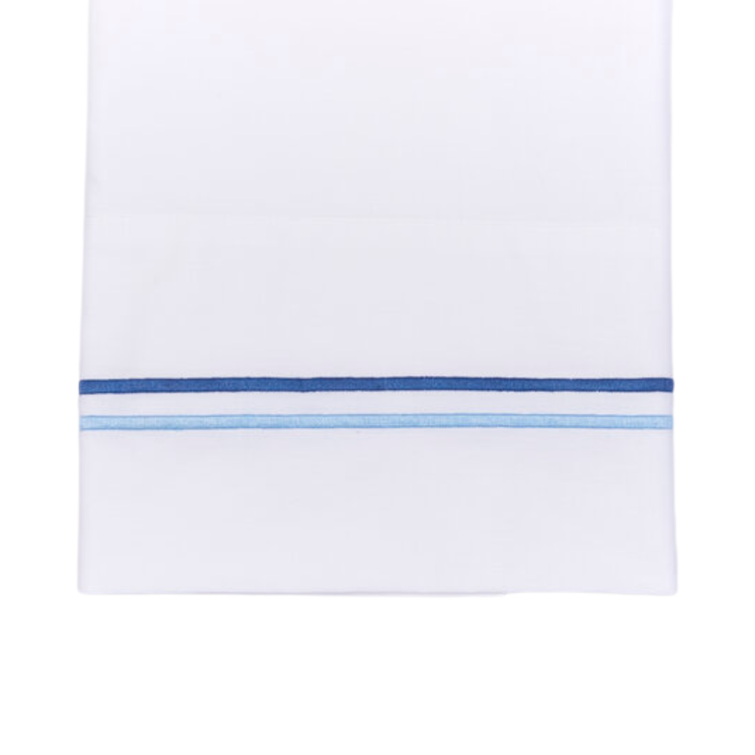 White sheet with two blue embroidered lines on white background