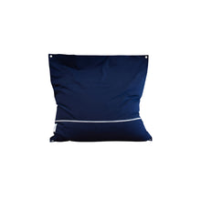 Navy blue pillow with white zipper on a light gray background