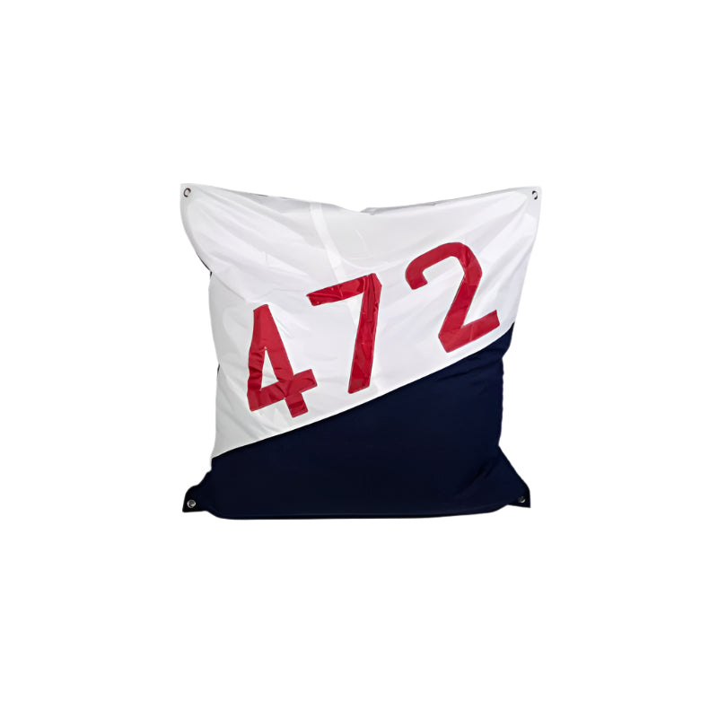 Decorative pillow with '472' printed on a white and navy background