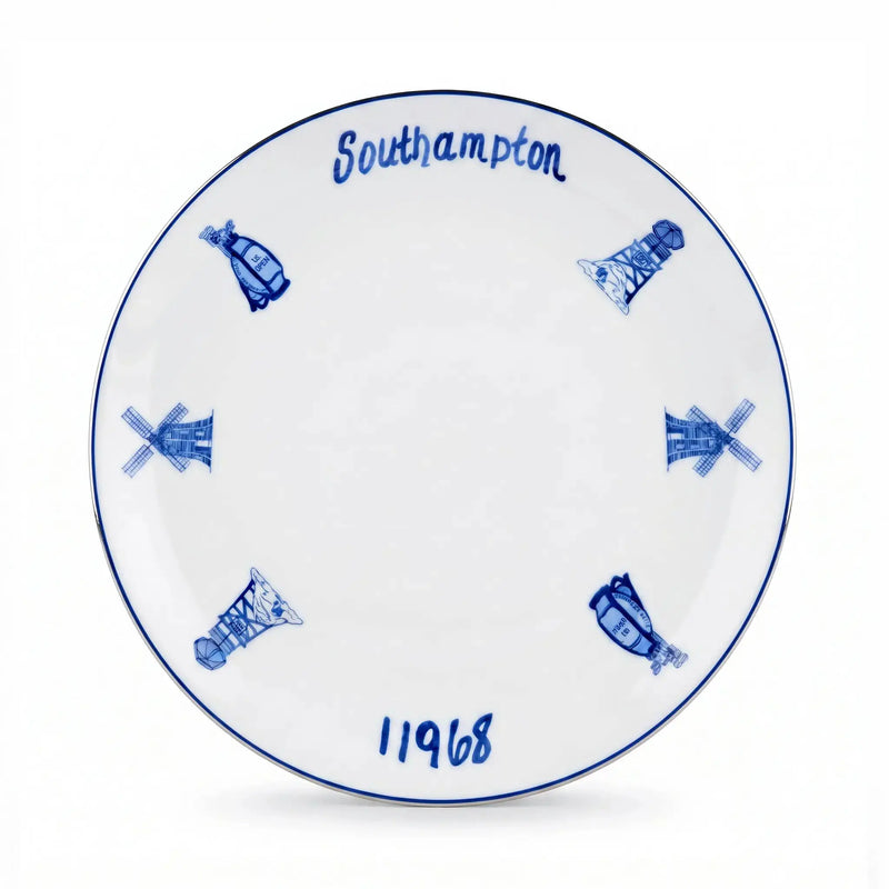 A white ceramic commemorative plate featuring blue illustrations of windmills, the word 'Southampton' at the top, and '11968' at the bottom.