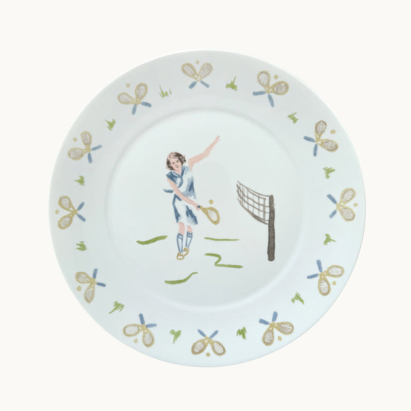 Decorative plate with a tennis player design and racket patterns on a white background