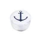White die with a blue anchor design on a white background