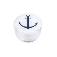 White die with a blue anchor design on a white background